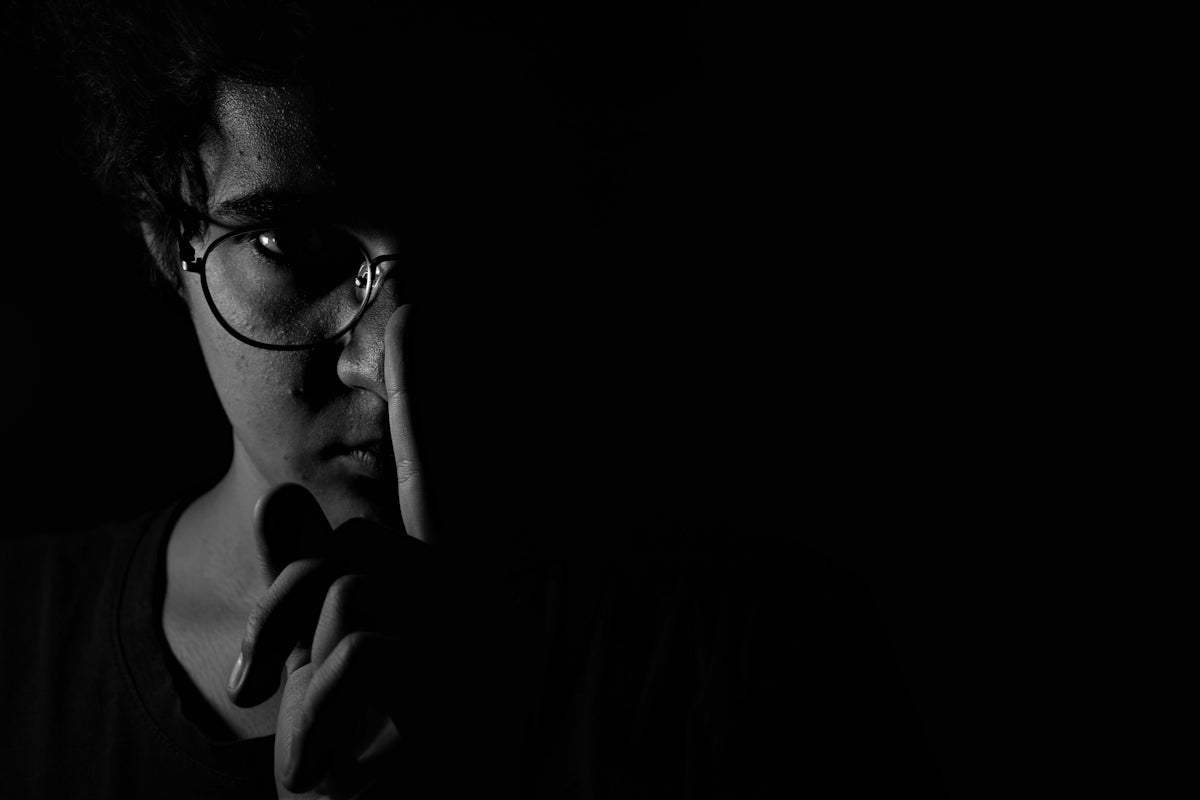 man wearing black framed eyeglasses