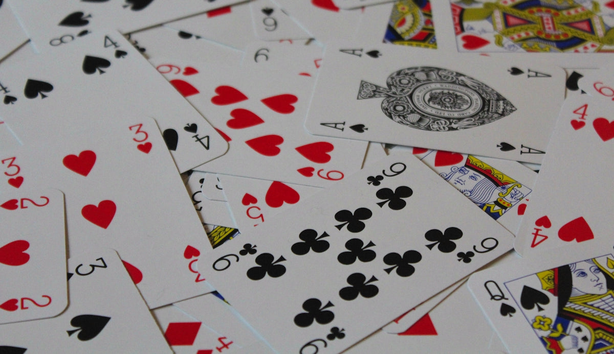 a pile of playing cards sitting on top of each other