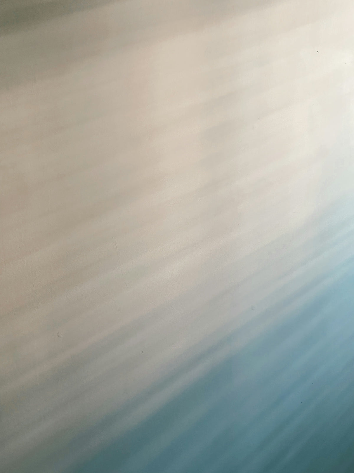a man riding a snowboard down a snow covered slope