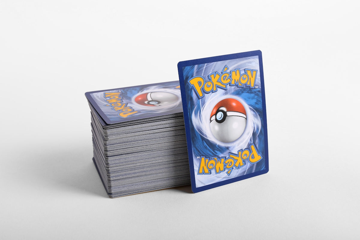 a stack of pokemon cards sitting on top of each other