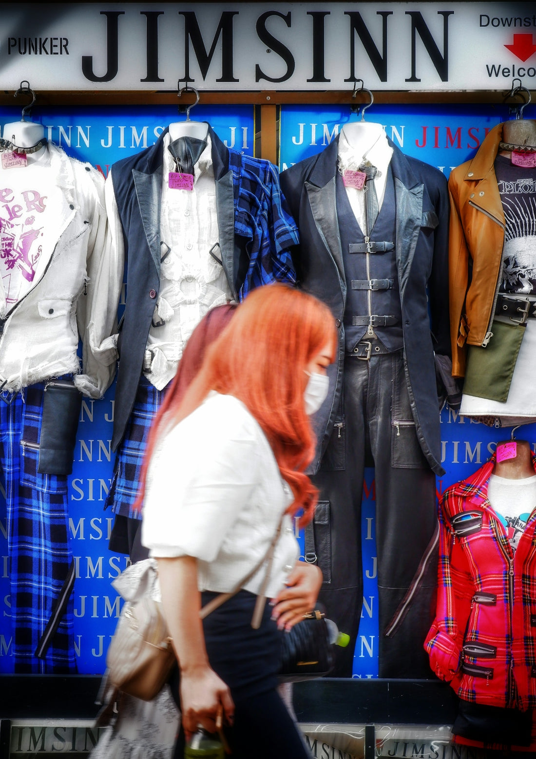 a person looking at a personnequin in a store