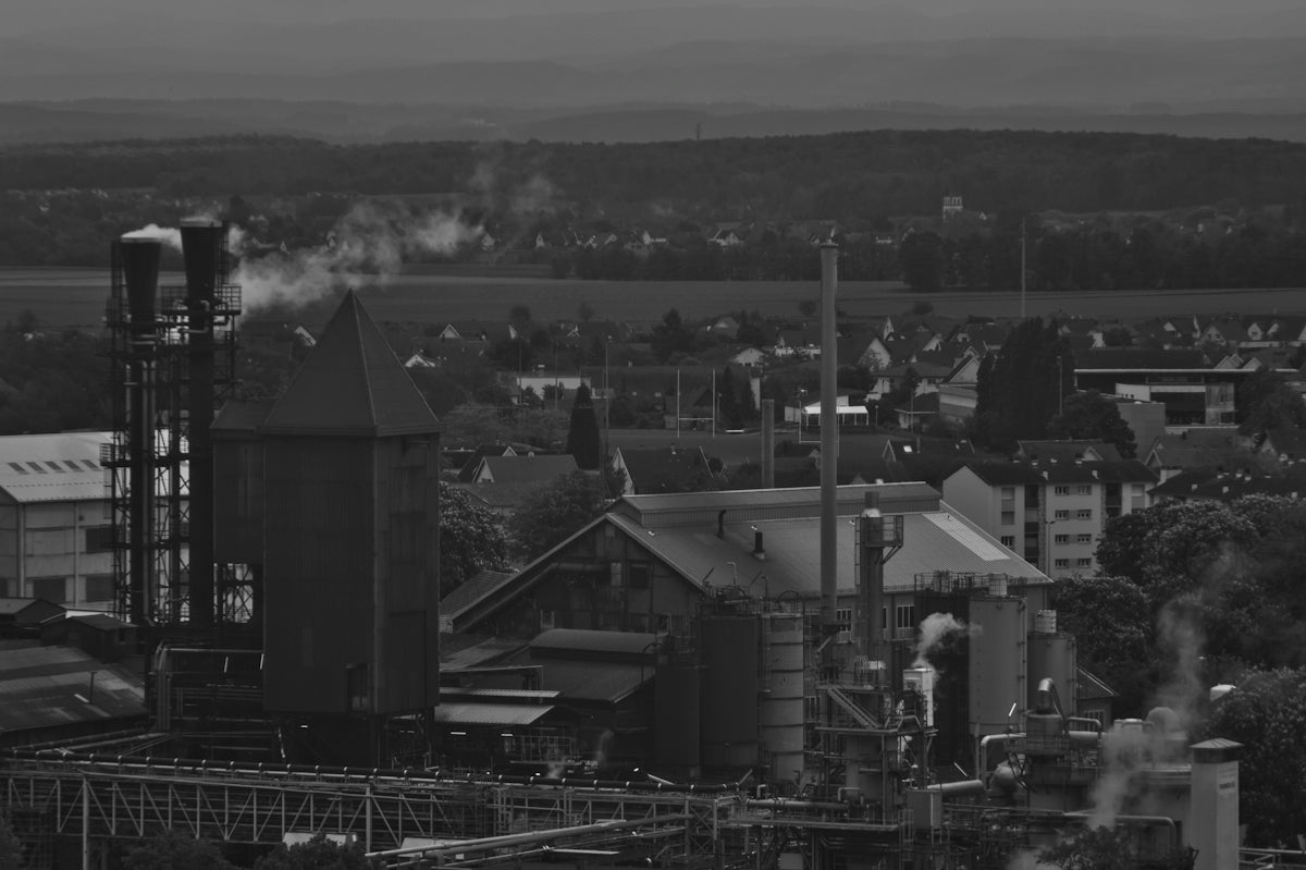 a factory with smoke coming out of it