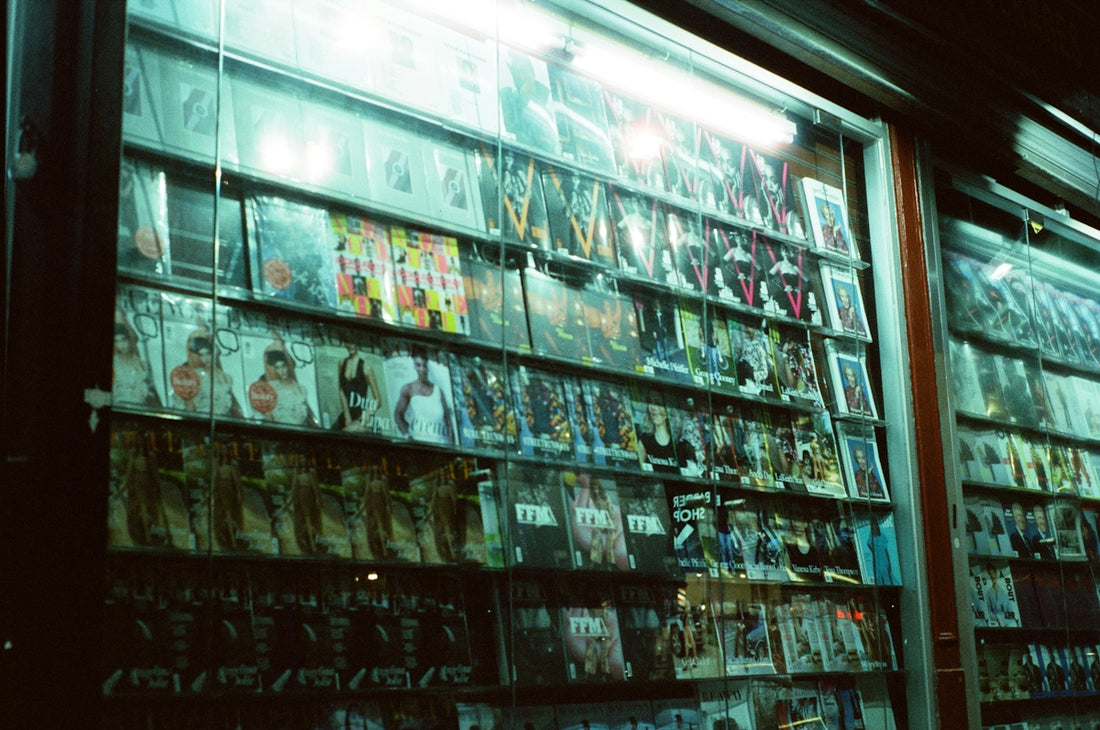 a store front with a lot of movies on display