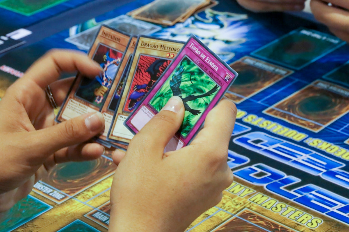 a person playing a card game on a table