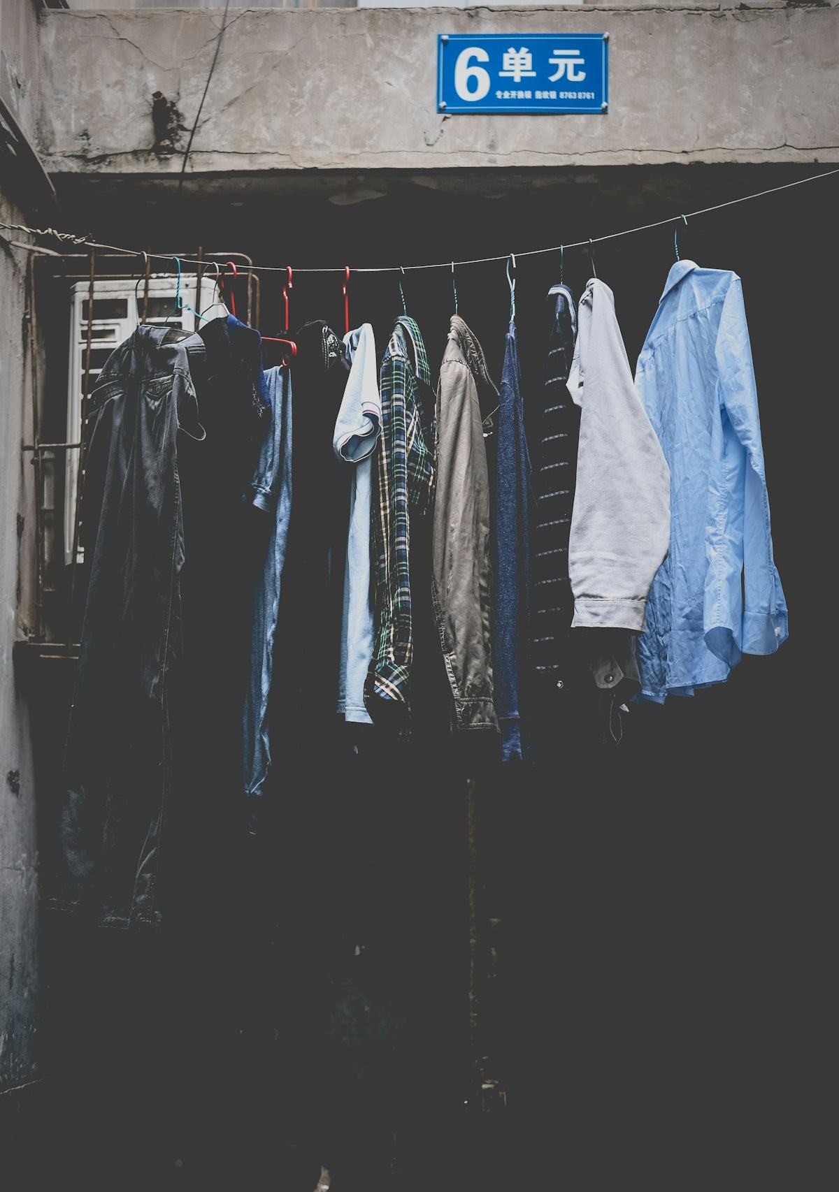 a bunch of clothes hanging on a clothes line