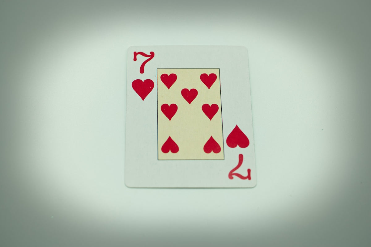 a playing card with hearts on it