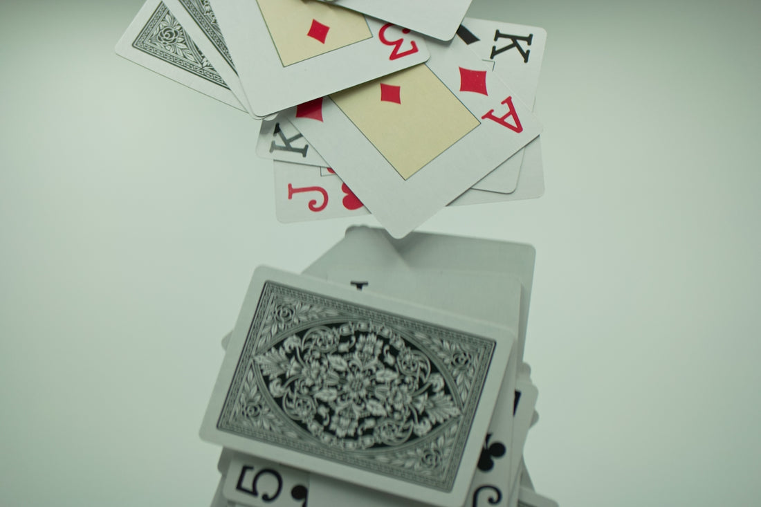 a stack of playing cards sitting on top of each other