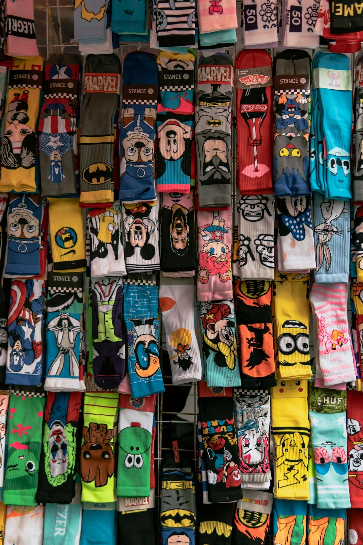 A display of socks with cartoon faces on them