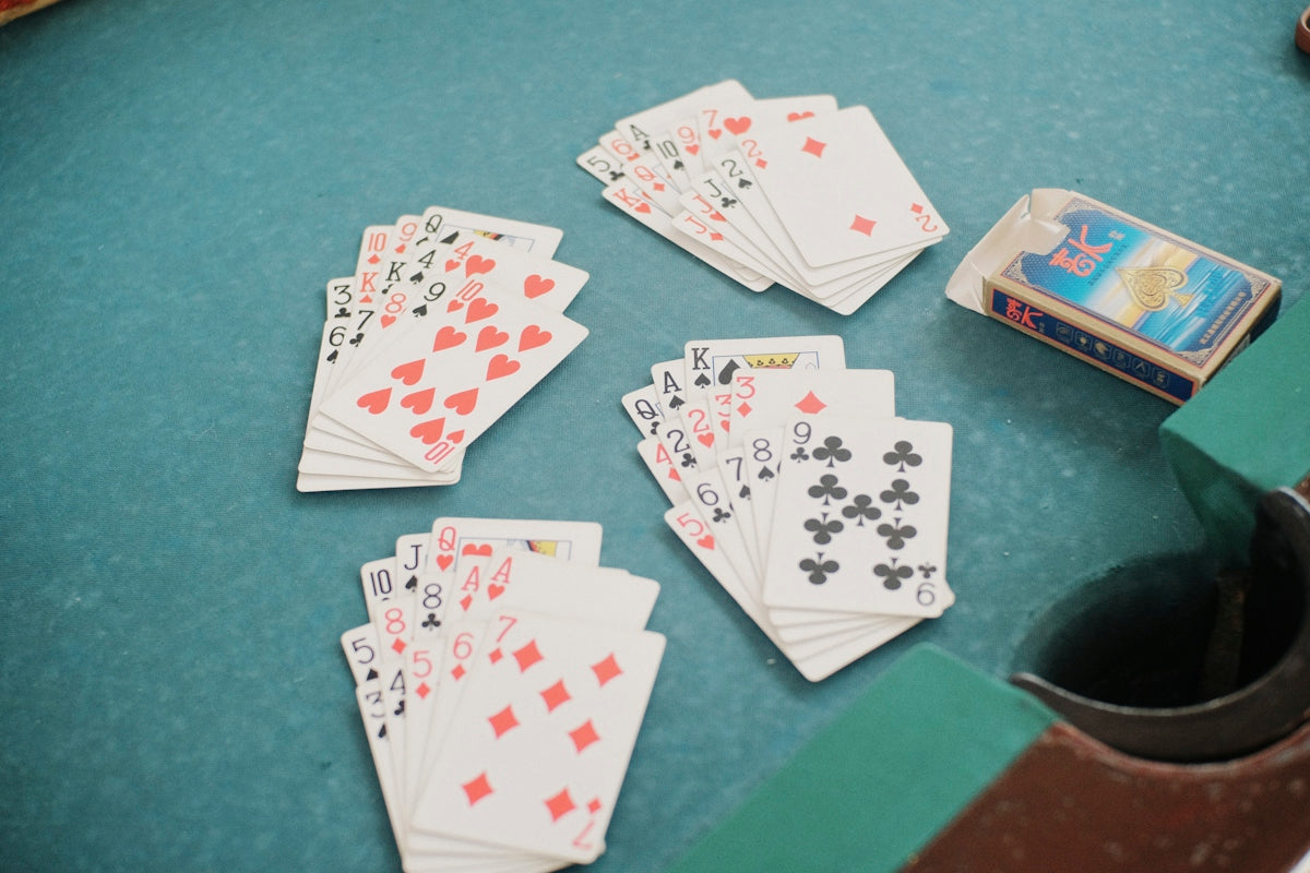 A table topped with lots of playing cards