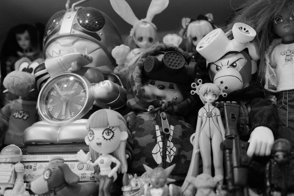 A collection of toys and figurines fills the shelf.