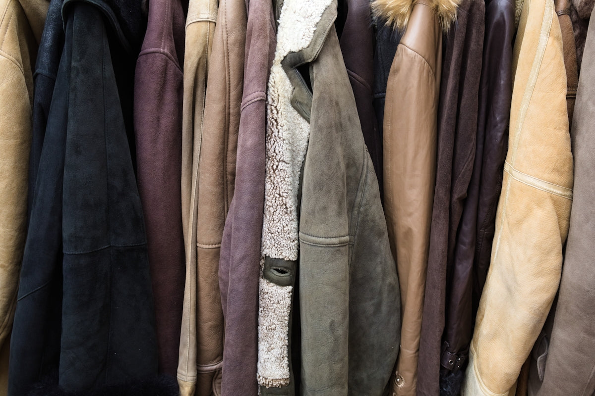 A collection of various leather jackets hanging